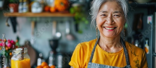 healthy asian aunt retired female woman enjoy making cook clean food breakfast for her healthy food lifestyle,smiling cheerful woman silver hair with tattoo prepare smoothie juice drink for her healtH