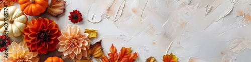 Autumn frame with yellow leaves, flowers and pumpkins on grey stone background for banner with copy space. Flat lay, top view. Thanksgiving, Halloween and Harvest day concept. 