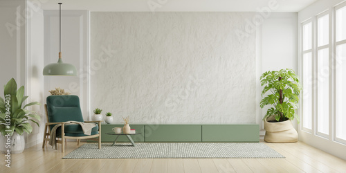Cabinet for TV with green armchair and decoration accessory on the white plaster wall in living room- 3D rendering