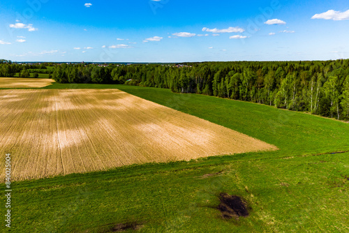 Straight boundaries of a plowed agricultural field, aerial view
