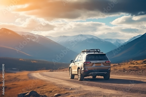 Mountain adventure: suv with roof rack gear journeying on spectacular dirt road