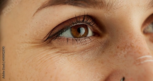 Eyes, thinking and future with person closeup in studio for hope, optimism or contemplation. Eye health, vision and planning with model looking away for natural cosmetics, optometry or satisfaction