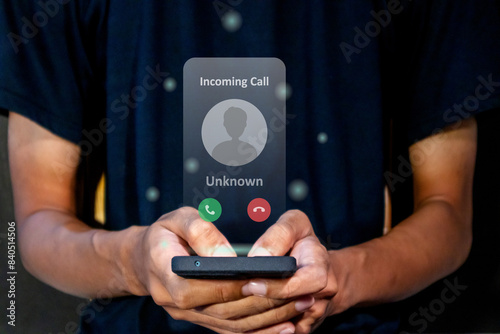 Man answering an incoming call from unknown number. Spammer incoming call concept.