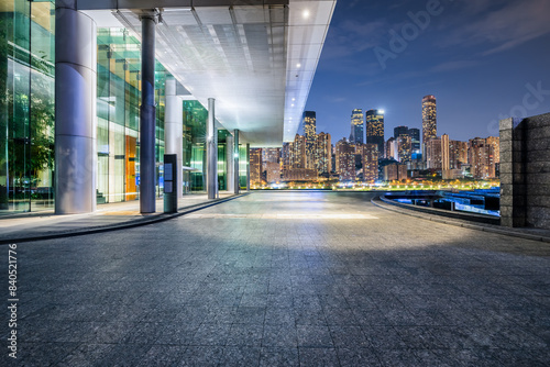 Pedestrian walkway and modern city commercial buildings scenery at night