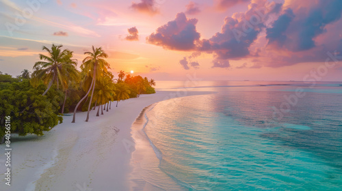 Picturesque shot of a serene beach in the Maldives during sunset, palm trees lining the shore, tranquil turquoise water