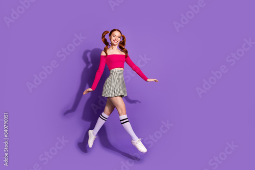Full length photo of shiny attractive lady dressed off shoulders top jumping high empty space isolated violet color background