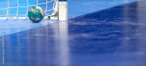 Gate and ball for futsal or handball in gym. Detail of gate frame and net. Outdoor football or handball playground. Horizontal sport poster, greeting cards, headers, website