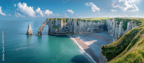 panoramic view of the white cliffs and blue sea at Etretat in France, sunny day, beautiful sky.