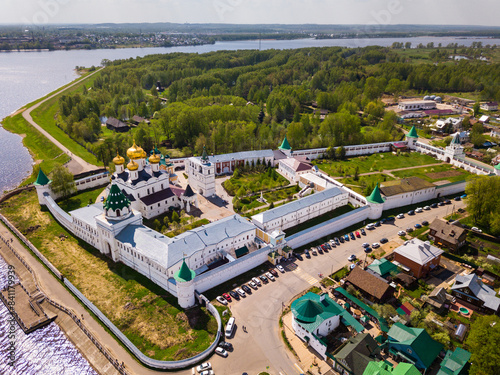 View of male Ipatiev Monastery on bank of river in Russian city of Kostroma on sunny spring day