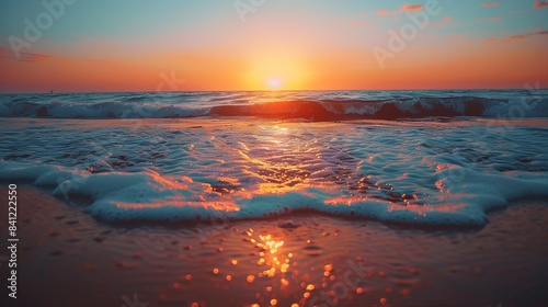 Sunset Glow on Seaside Waves. The breathtaking moment of a sunset over the ocean, with waves gently lapping at the shore, highlighted by the warm hues of the setting sun.