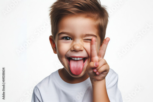 Funny child with tongue out and winking Isolated on white background