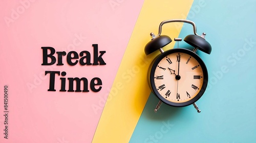 Black Alarm Clock with "Break Time" on Colorful Background 