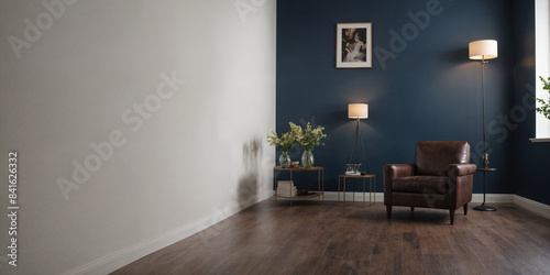 Vintage old room with leather armchair and wooden flooring in classic style and a lot of suitcases with blue wall. Copy space. Vogue and luxury.