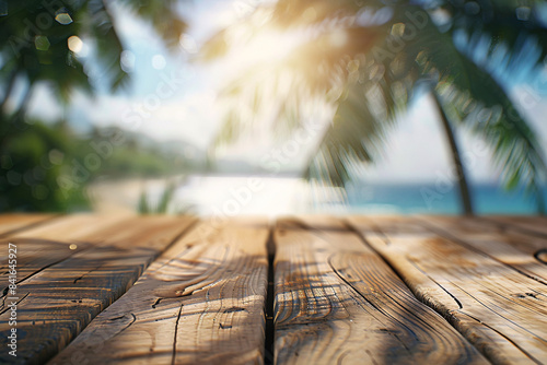 Rustic wooden deck overlooking a serene tropical beach with blurred palm trees and ocean in the background