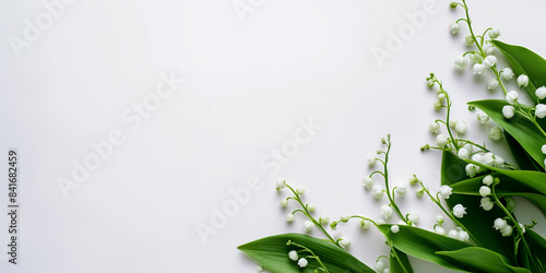 Minimalistic lily of the valley flowers with green leaves