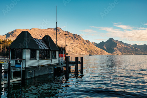 Queenstown waterfront with wooden dock and mountain on Lake Wakatipu at New Zealand