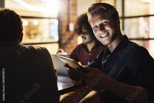 Portrait, tablet and employee in night, happy and research for deadline in office, online and finance. Boardroom, dark and man working late, auditor and collaboration for project, budget or company