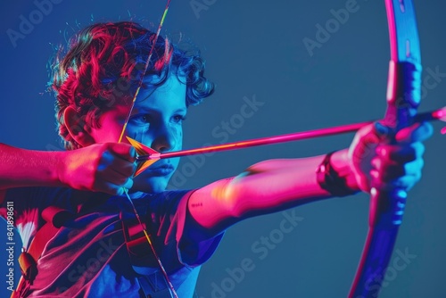Portrait of a youth holding a bow and arrow, suitable for outdoor or adventure themed projects
