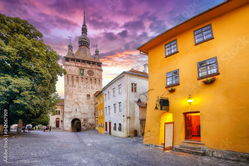 Amazing evening view of historic town Sighisoara and Clock Tower built by Saxons.