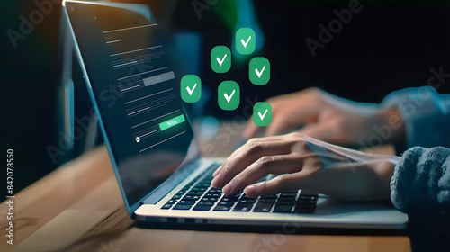 A person typing on their laptop with green checkmark icons floating above the keyboard. attention to detail and quality control in work 