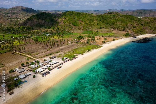 Aerial view of a beautiful tropical beach and wooden shacks (Tampah, Lombok)