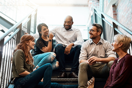 Office, stairs and business people on break for talking, hangout and discussion with laugh. Creative agency, men and women as journalist with conversation, relax and funny memory in workplace steps