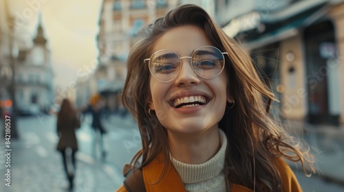Beautiful young woman in portrait grinning through her glasses. Fashionable models dress in chic attire. traversing streets. view of the city behind