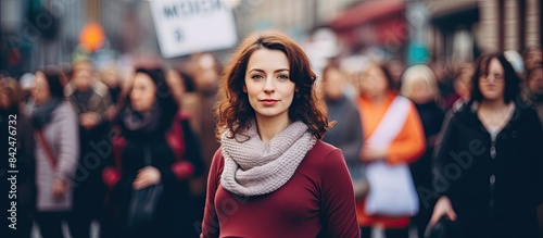Woman holds a placard displaying "My Body My Choice" at a protest advocating for abortion rights; in the background, a copy space image.