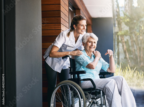 Nurse, senior woman and support on wheelchair for help or rehabilitation of medical healthcare patient. Happy caregiver, retirement and person with disability at home for recovery or care outdoor