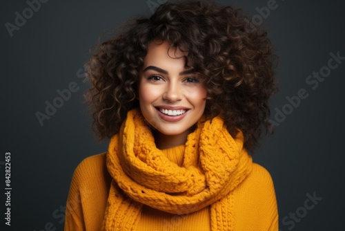 Happy and flattered beautiful smiling girl with curly hair, use a warm yellow swea, generative IA