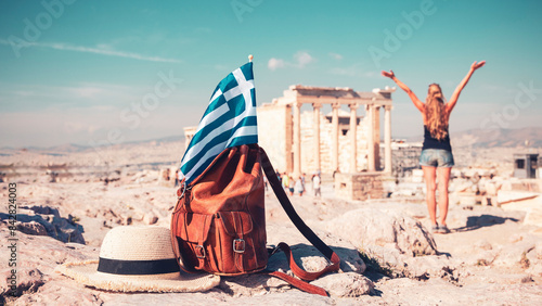 Travel destination in Greece- Bag, summer hat and greek flag at Athens, Parthenon, Acropolis