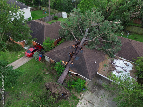 Homes with severe damage to their roofs after a tornado moved through the Houston area on May 16, 2024.