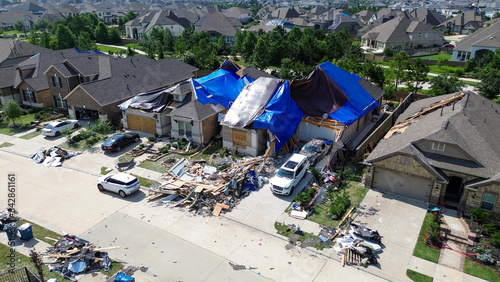 Homes with severe damage to their roofs after a tornado moved through the Houston area on May 16, 2024.