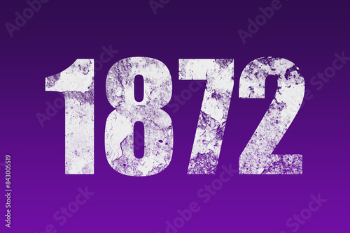 flat white grunge number of 1872 on purple background. 