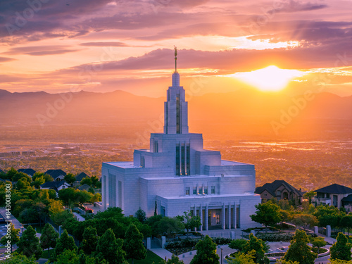 Clouds form rays of sunshine behind the Draper Utah Temple