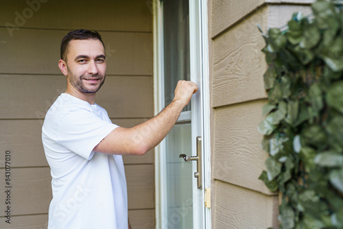 Door to door sales man knocking on the door