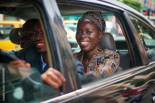 A beautiful woman smiles at the camera with friends in the car during an urban ride