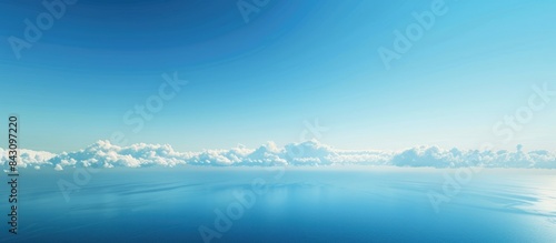 Vast expanse of azure ocean and cloudless heavens merging seamlessly. Room for text or design.