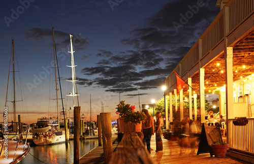 Restaurants and boats along the boardwalk at night in downtown Beaufort North Carolina