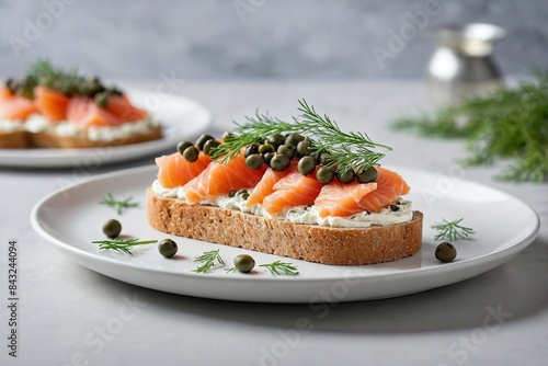 Elegant Open-Faced Sandwich: an elegant open-faced sandwich with smoked salmon, cream cheese, capers, and dill on a slice of rye bread.