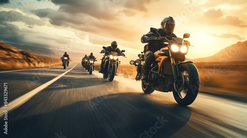 A group of motorcyclists riding on a highway, captured in motion with a dramatic sky overhead