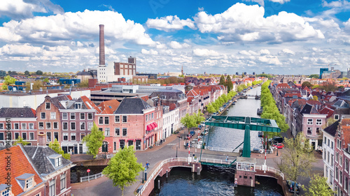 Aerial drone view of Leiden town from above, typical Dutch city skyline with canals and houses, Holland, Netherlands