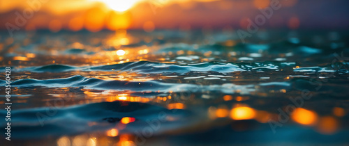 Abstract blur of sunlight reflecting on the surface of a calm ocean