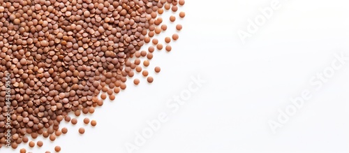 Top view of a circular buckwheat background texture on a white backdrop offering a copy space image for text