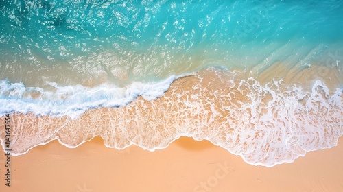 Aerial view of tide blue sea water and sandy beach