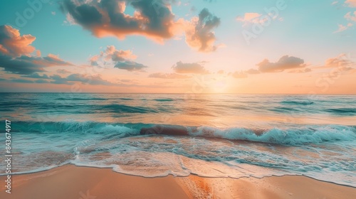 A peaceful beach scene at sunset with waves gently lapping against the shore. The sky is filled with colorful clouds, creating a beautiful and serene atmosphere