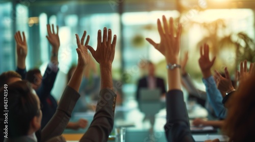 Hands of crowd in air in a vote event in a office room during an executive board meeting.