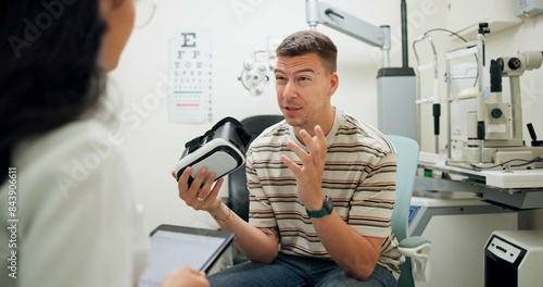 Patient, optometry and talking for eye care, advice and consultation with question for optometrist. Man, discussion and vr goggles for healthcare innovation or assessment with confused, wow and wtf