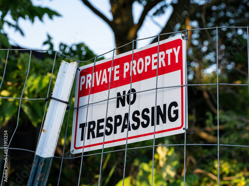 no trespassing sign on a fence