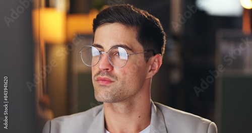 Businessman, glasses and working at night in office with computer for administration, planning and research. Accountant, tech and commitment in workplace for accounting, budget and financial audit